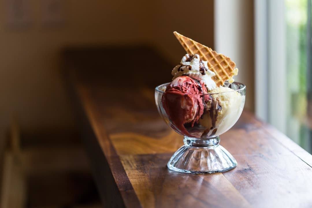 We loved trying CBD ice cream at Prohibition Creamery! Photo: A sundae made with Prohibition Creamery's CBD ice cream, garnished with a waffle cone piece.
