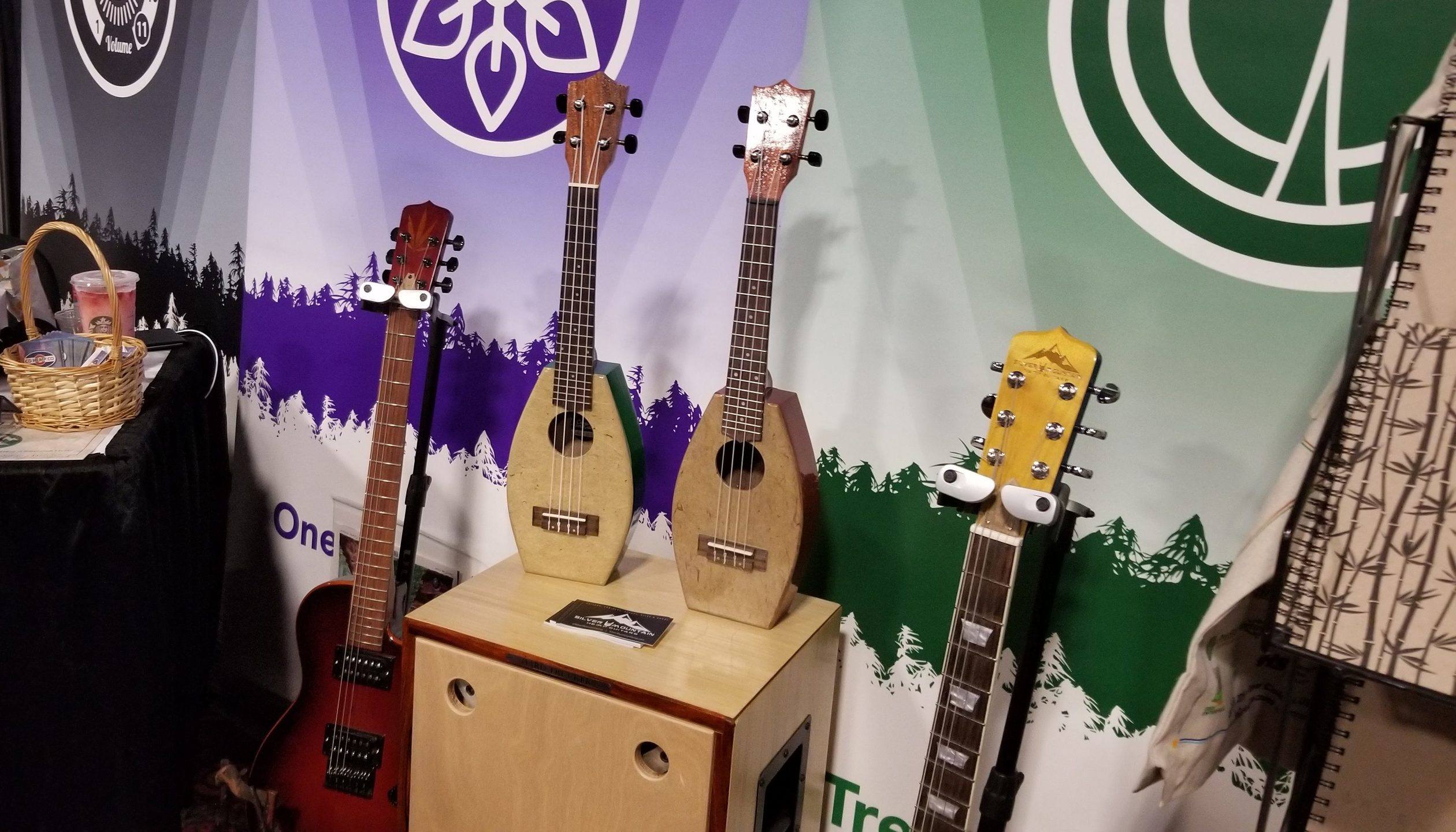 Hemp guitars and a hemp ukelele from Silver Mountain Hemp Guitars, on display at NoCo 6, the 2019 Noco Hemp Expo in Denver, Colorado.